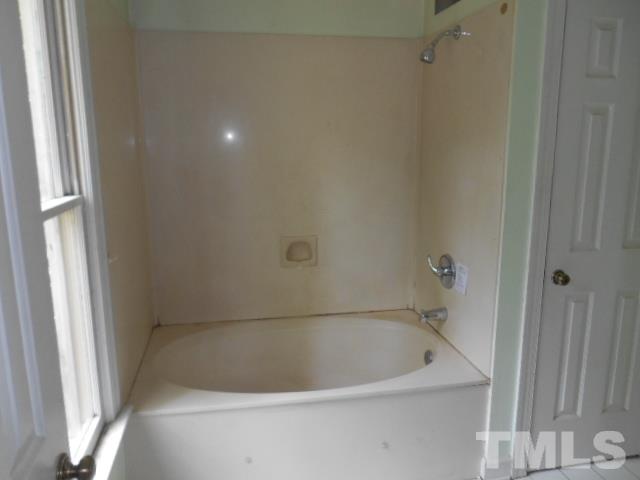 10821 Fanny Brown Road Raleigh, NC 27603 - Photo 8 of 9 a bathroom with a bathtub