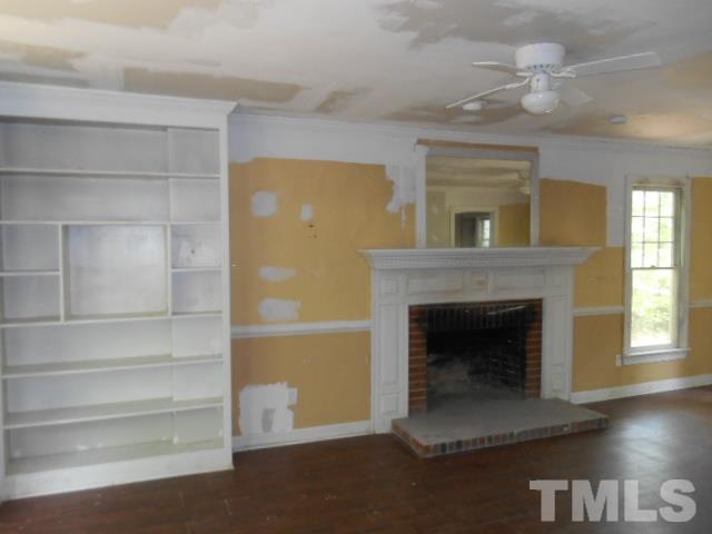 10821 Fanny Brown Road Raleigh, NC 27603 - Photo 9 of 9 a living room with furniture and a fireplace