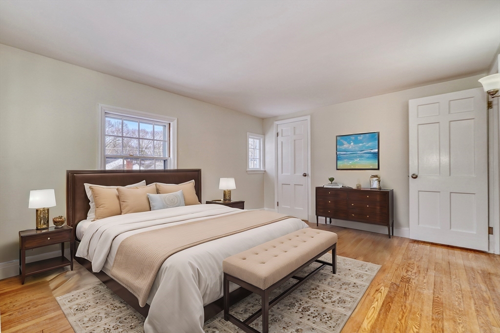 45 Bancroft Road Melrose, MA 02176 - Photo 16 of 37 a bedroom with a bed and a couch