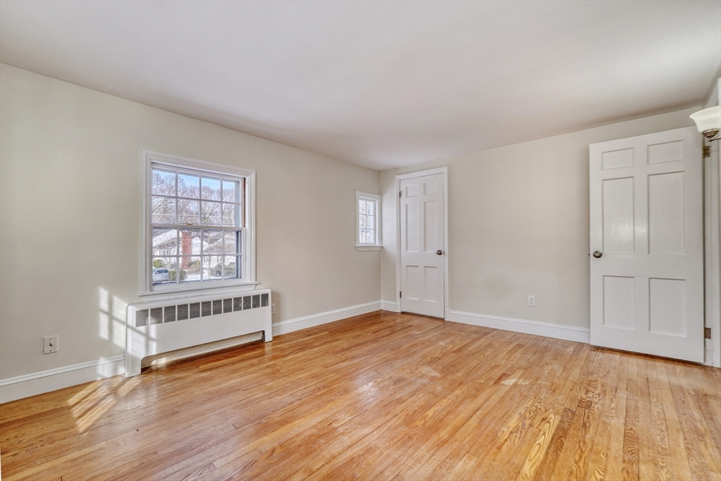 45 Bancroft Road Melrose, MA 02176 - Photo 17 of 37 an empty room with wooden floor and windows