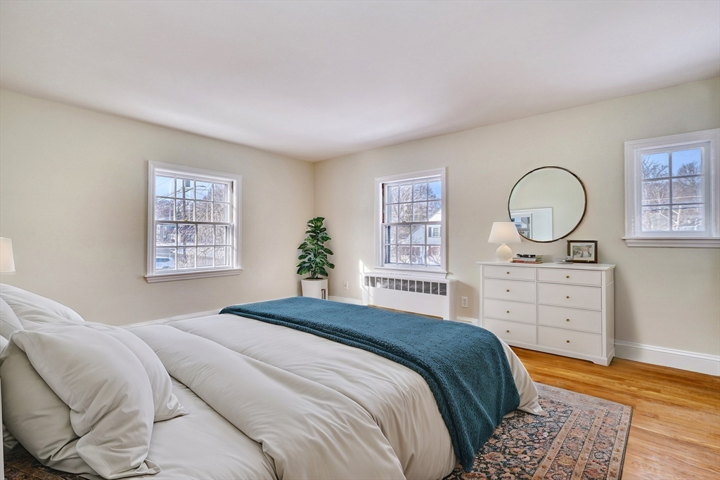 45 Bancroft Road Melrose, MA 02176 - Photo 18 of 37 a bedroom with a bed a dresser and a window