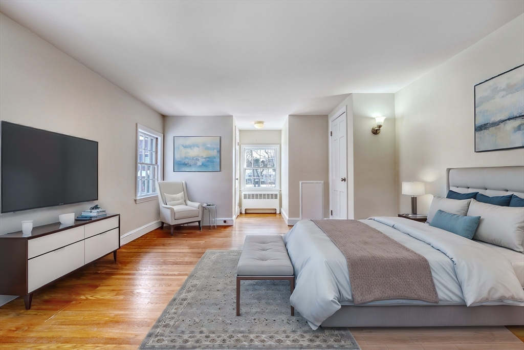 45 Bancroft Road Melrose, MA 02176 - Photo 20 of 37 a bedroom with furniture and a flat screen tv