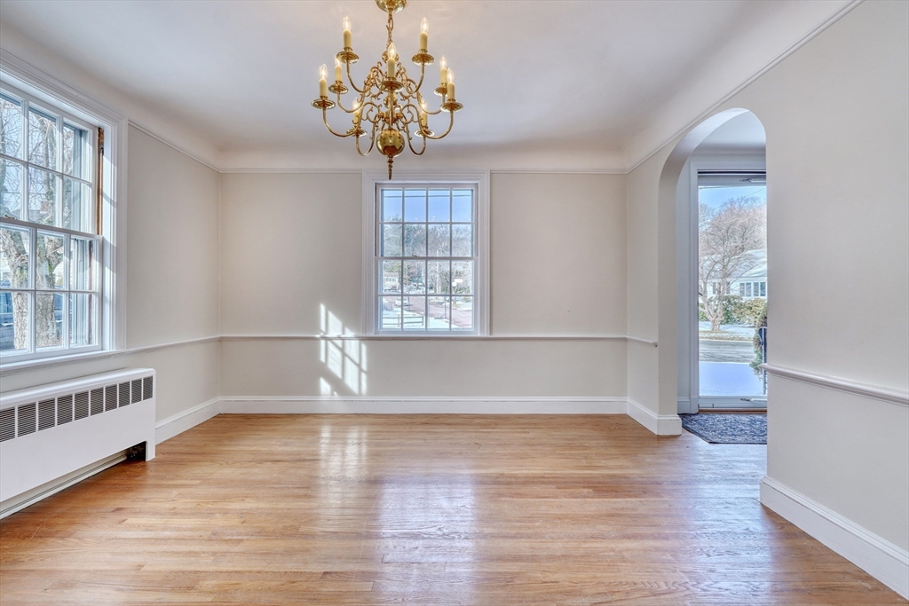 45 Bancroft Road Melrose, MA 02176 - Photo 8 of 37 a view of an empty room with wooden floor and a window