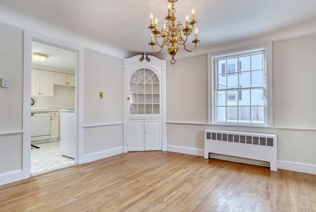 45 Bancroft Road Melrose, MA 02176 - Photo 9 of 37 wooden floor in an empty room with a window