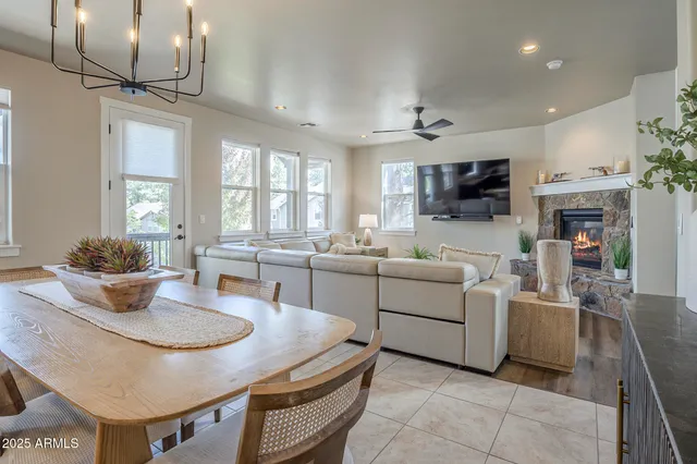 a view of living room kitchen with furniture and a fireplace