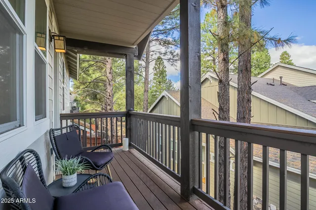 a bathroom with a tub a sink and a window