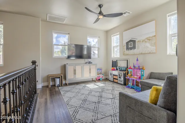 a bathroom with a granite countertop sink mirror and toilet