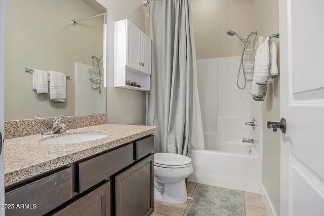 a large bathroom with a tub and sink