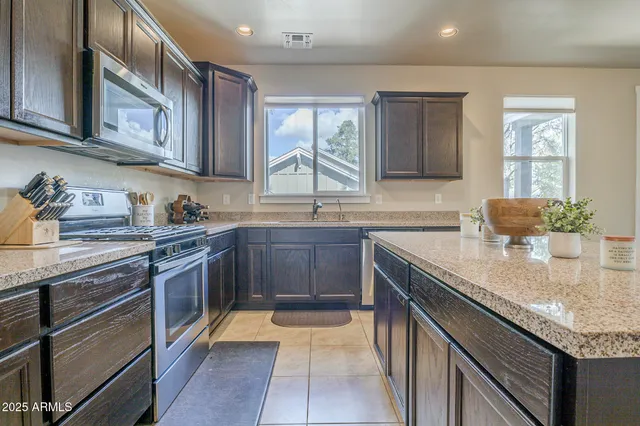a living room with furniture fireplace and flat screen tv