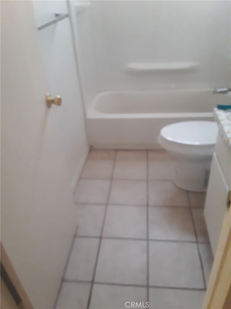 2248 North Arrowhead Avenue Rialto, CA 92377 - Photo 12 of 13 a bathroom with a sink and toilet