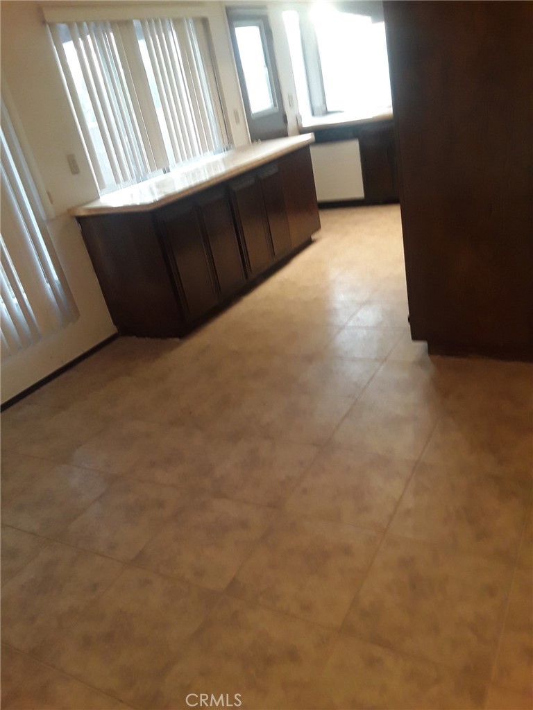 2248 North Arrowhead Avenue Rialto, CA 92377 - Photo 8 of 13 a view of an empty room with a window
