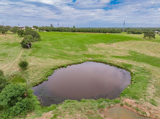 a view of a lake with a building in the background