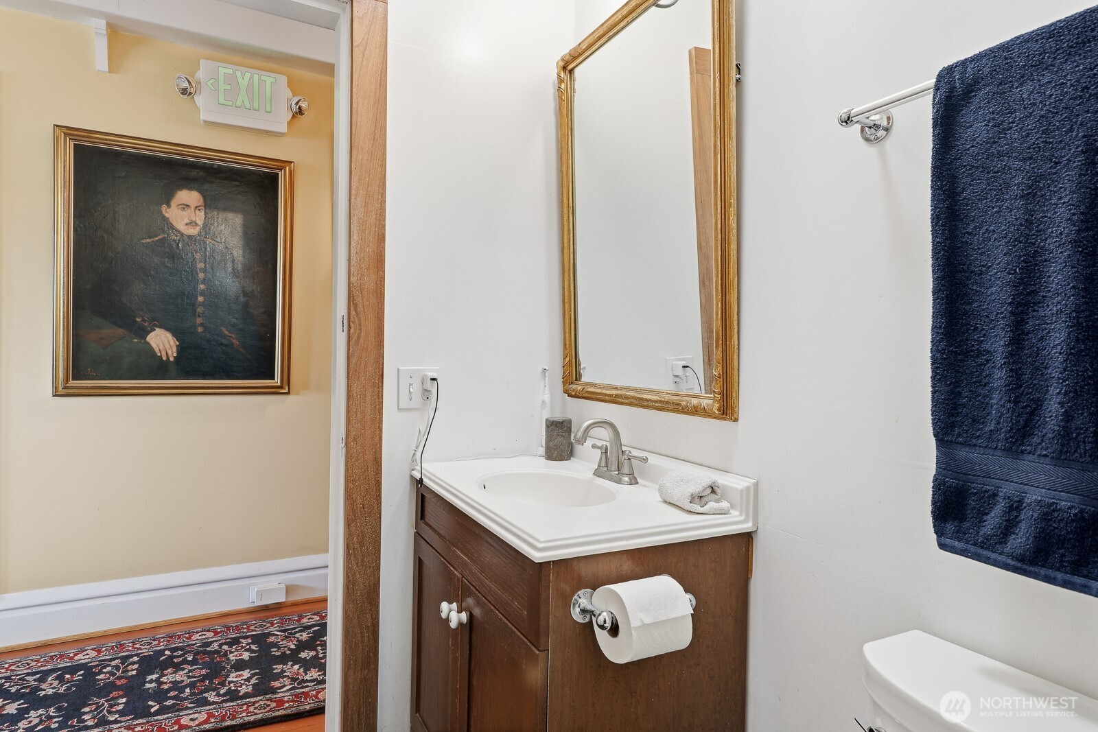 211 14th Avenue East Seattle, WA 98112 - Photo 17 of 32 a bathroom with a sink and a mirror