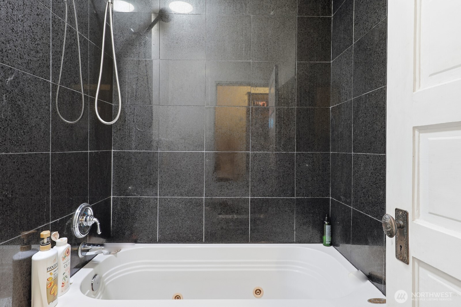 211 14th Avenue East Seattle, WA 98112 - Photo 18 of 32 a bathroom with a bath tub and a shower