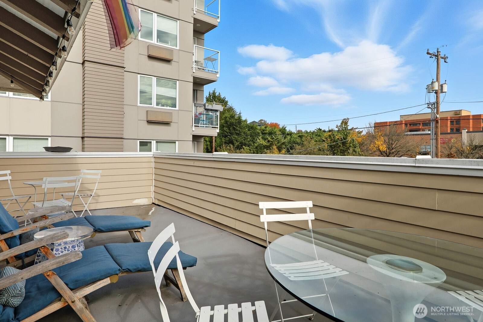 211 14th Avenue East Seattle, WA 98112 - Photo 19 of 32 a view of a chair and tables in the balcony