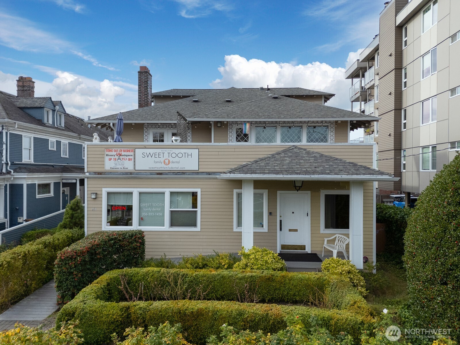 211 14th Avenue East Seattle, WA 98112 - Photo 2 of 32 a front view of a house with a garden