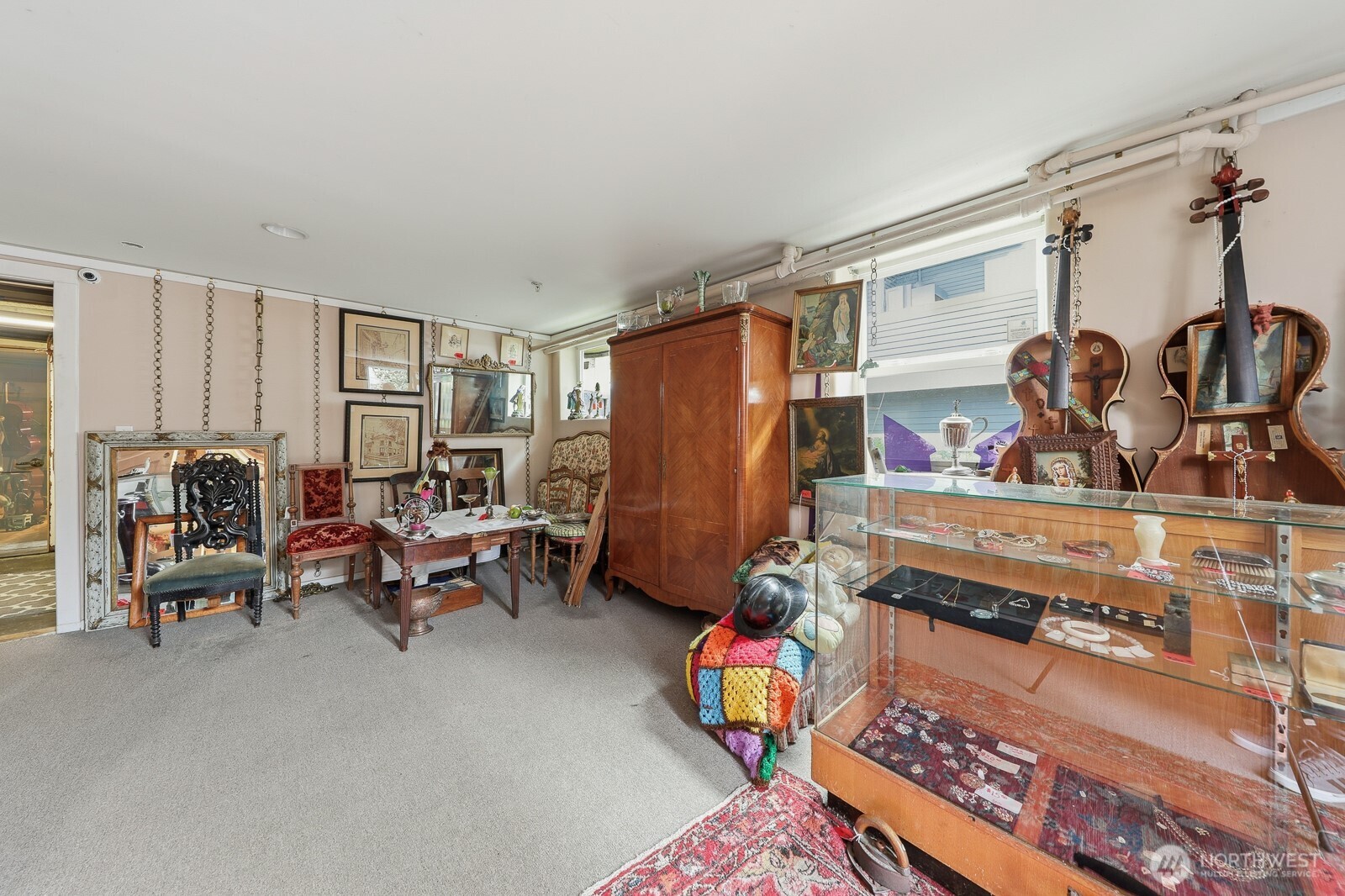 211 14th Avenue East Seattle, WA 98112 - Photo 30 of 32 a living room with furniture and a window