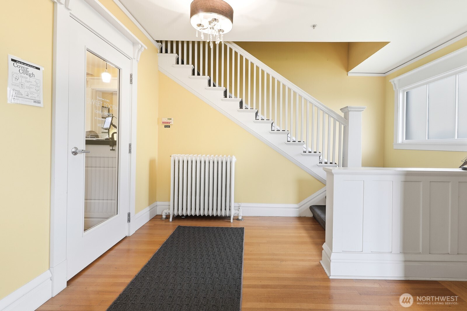 211 14th Avenue East Seattle, WA 98112 - Photo 3 of 32 a view of entryway and hall with wooden floor
