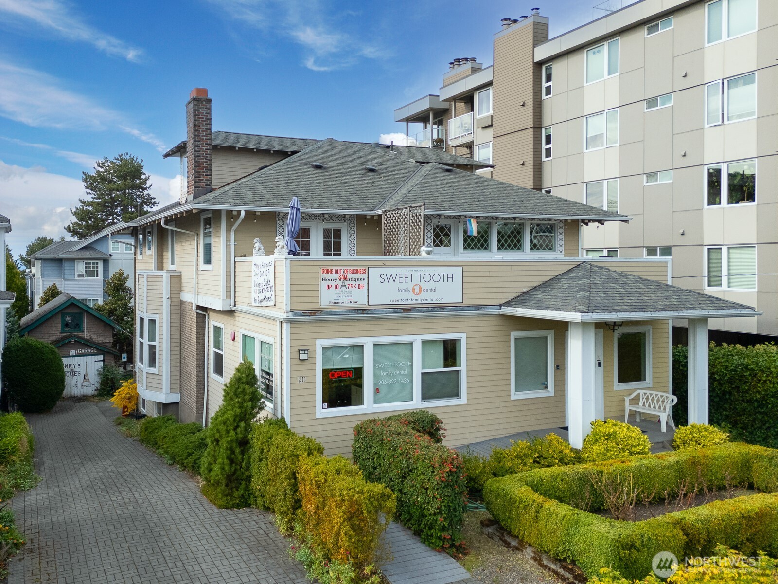211 14th Avenue East Seattle, WA 98112 - Photo 32 of 32 a front view of a house with a yard