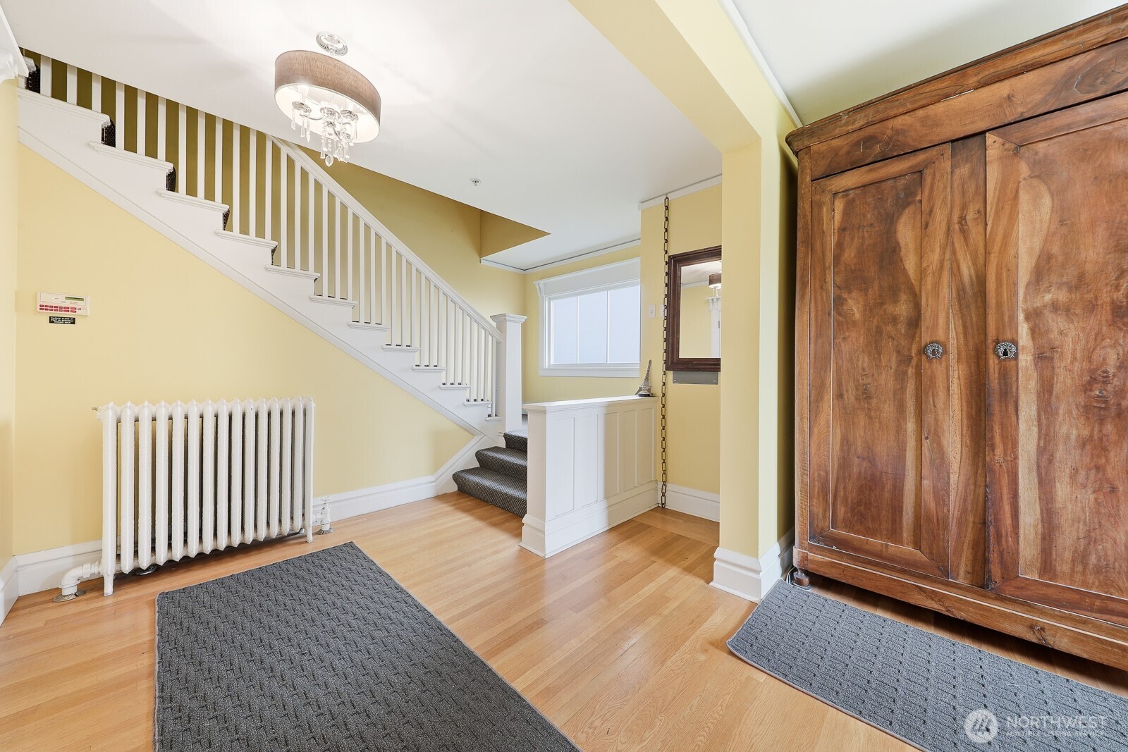 211 14th Avenue East Seattle, WA 98112 - Photo 5 of 32 a view of entryway with wooden floor and stairs