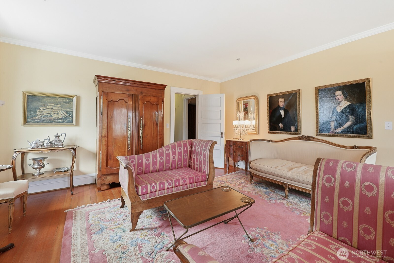 211 14th Avenue East Seattle, WA 98112 - Photo 6 of 32 a spacious bedroom with a bed a couch and dresser