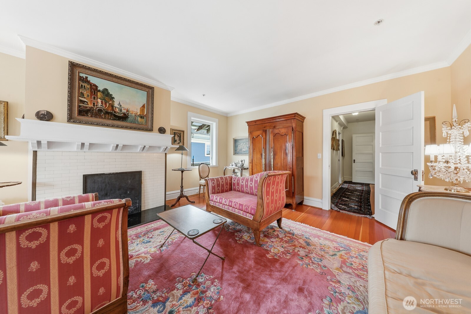 211 14th Avenue East Seattle, WA 98112 - Photo 9 of 32 a living room with furniture a flat screen tv and a fireplace