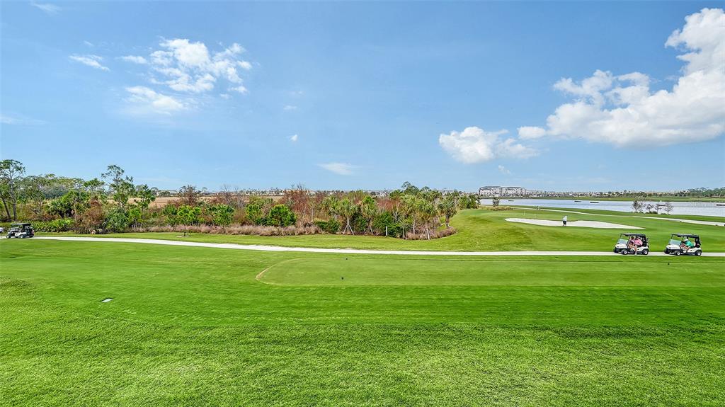 12180 Wellen Golf Street, Unit 202 Venice, FL 34293 - Photo 11 of 88 a view of a golf course with a lake