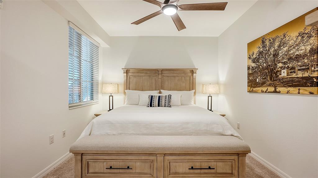 12180 Wellen Golf Street, Unit 202 Venice, FL 34293 - Photo 22 of 88 a large bed sitting in a bedroom next to a window