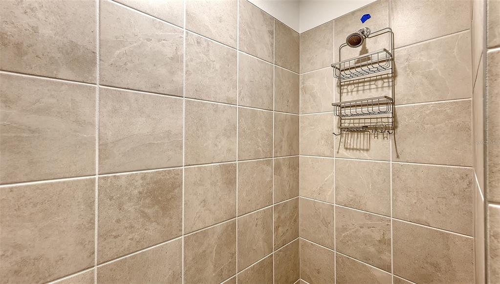12180 Wellen Golf Street, Unit 202 Venice, FL 34293 - Photo 25 of 88 a bathroom with a shower