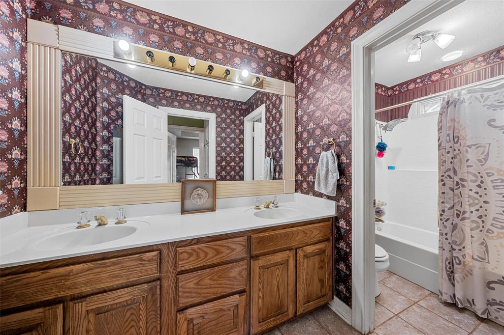 654 County Road 473 Lott, TX 76656 - Photo 17 of 40 a bathroom with a sink and a mirror