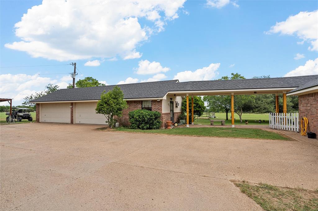 654 County Road 473 Lott, TX 76656 - Photo 21 of 40 a view of a house with a yard and large tree
