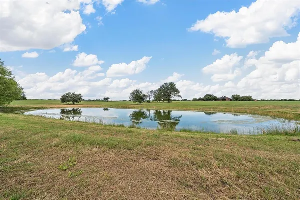 a view of a golf course with a lake