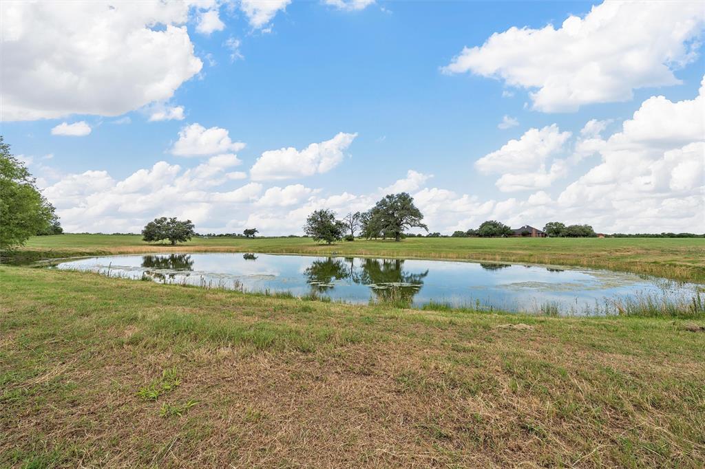 654 County Road 473 Lott, TX 76656 - Photo 35 of 40 a view of a lake with houses in the back