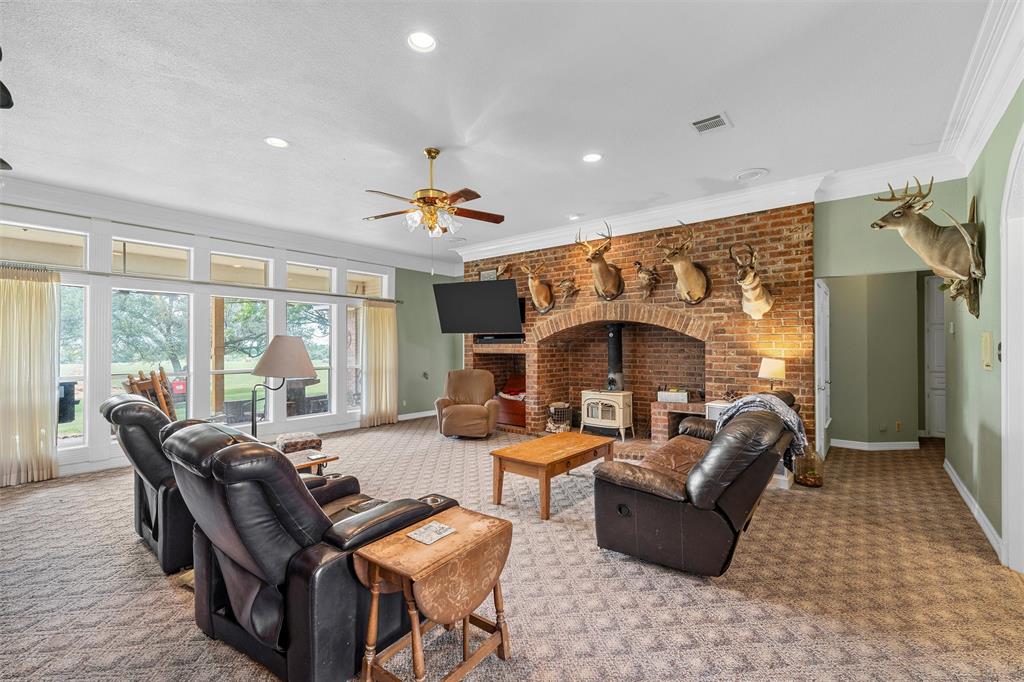 654 County Road 473 Lott, TX 76656 - Photo 5 of 40 a living room with furniture and a fireplace