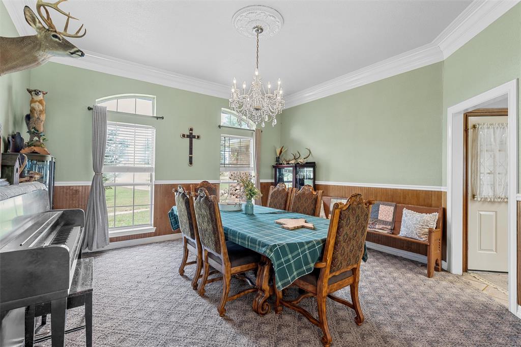 654 County Road 473 Lott, TX 76656 - Photo 8 of 40 a view of a dining room with furniture window and wooden floor