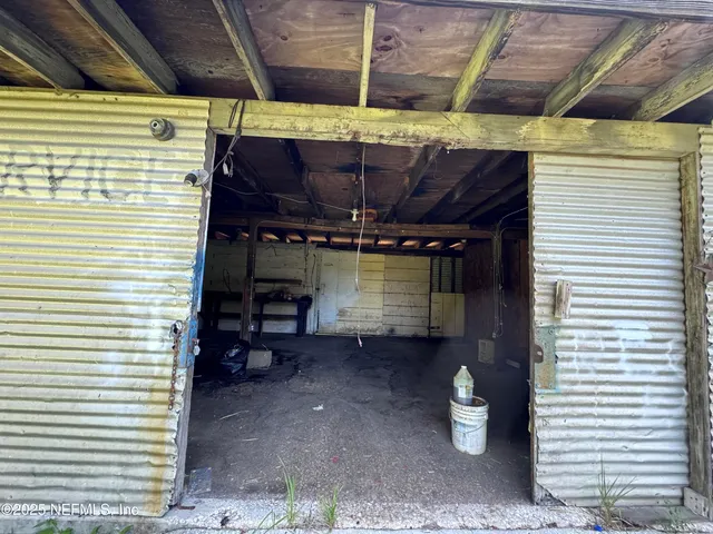 a view of a room with wooden walls