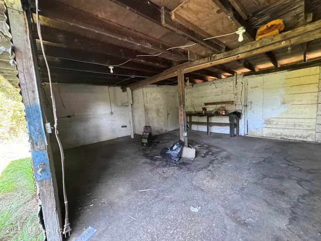 a view of a room with wooden walls