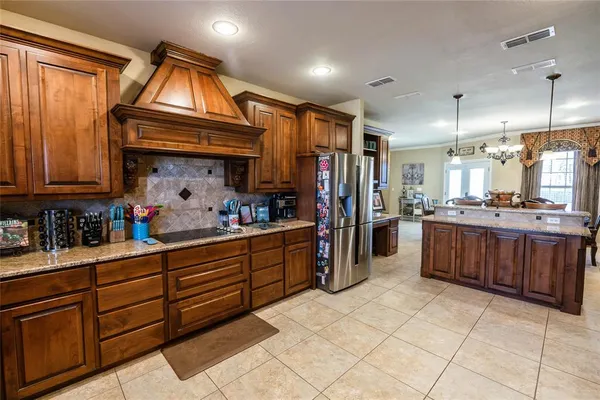 a kitchen with sink cabinets and refrigerator