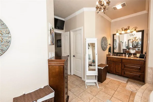 a bedroom with furniture and a window
