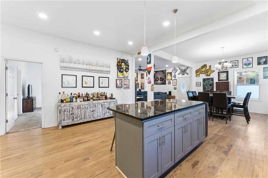 902 Gaston Street Southwest Atlanta, GA 30310 - Photo 11 of 36 a kitchen with stainless steel appliances granite countertop sink cabinets and wooden floor