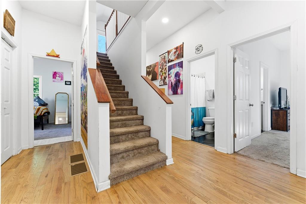 902 Gaston Street Southwest Atlanta, GA 30310 - Photo 14 of 36 a view of a hallway with wooden floor and workspace