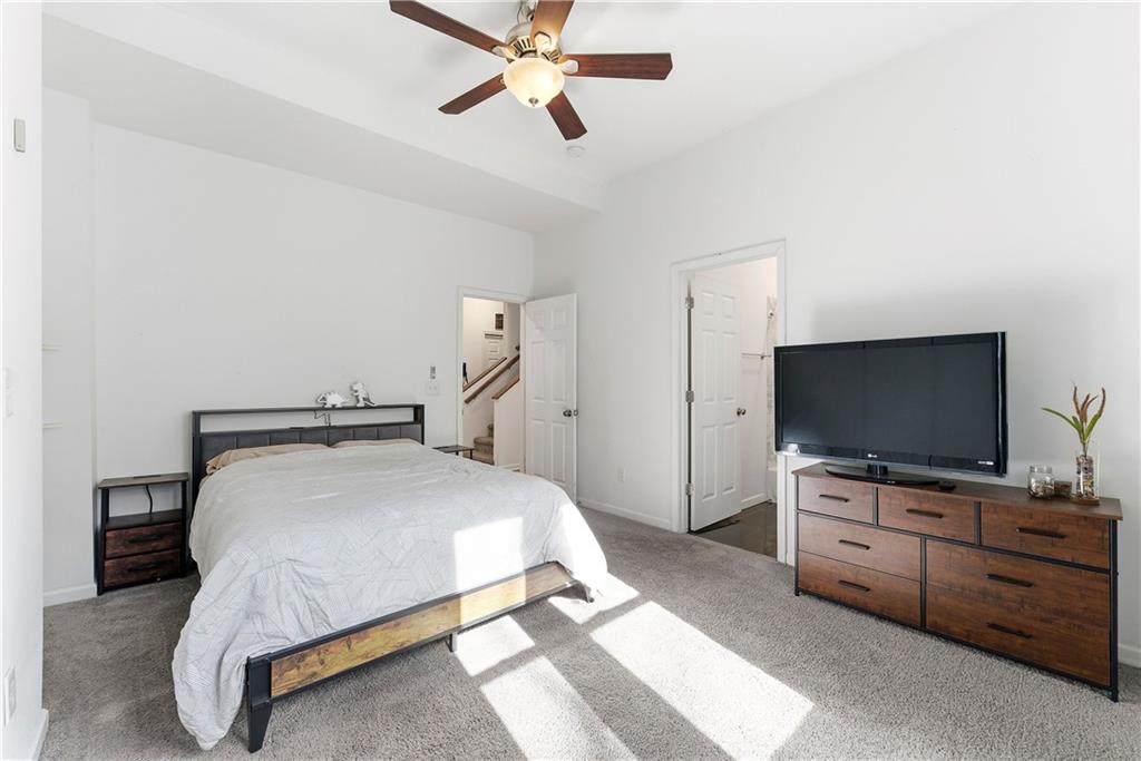 902 Gaston Street Southwest Atlanta, GA 30310 - Photo 17 of 36 a bedroom with a bed and flat screen tv