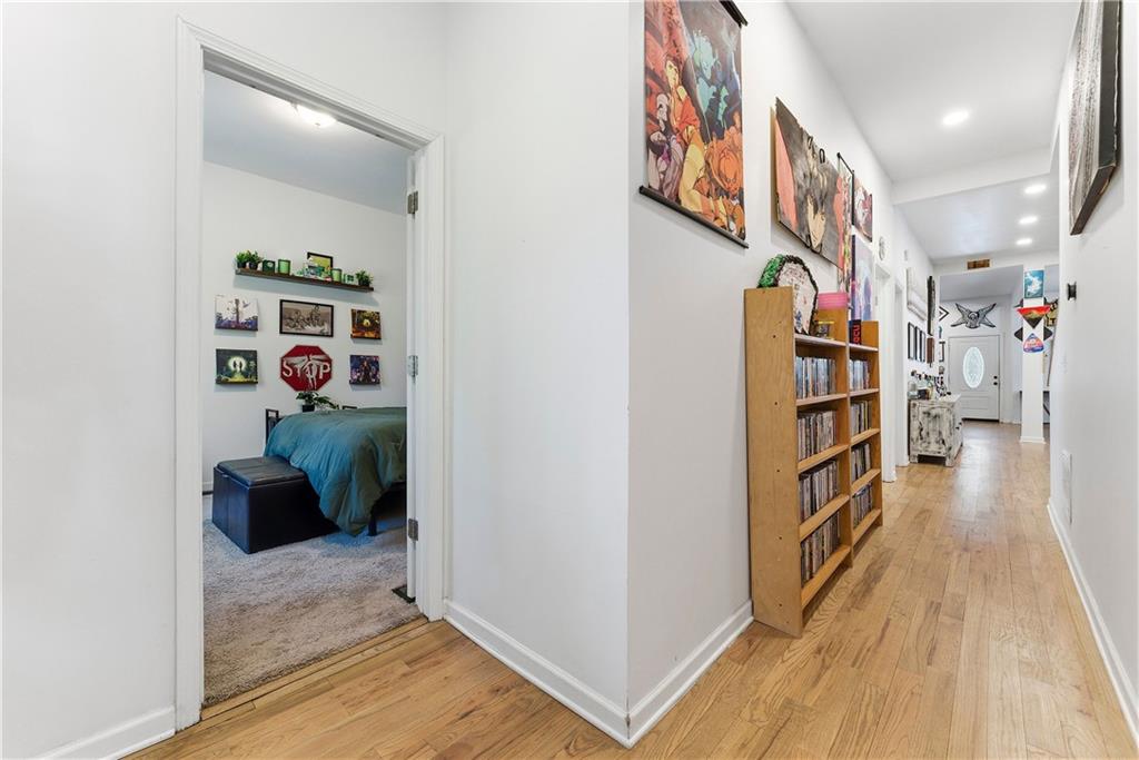 902 Gaston Street Southwest Atlanta, GA 30310 - Photo 20 of 36 a view of a hallway with wooden floor and stairs