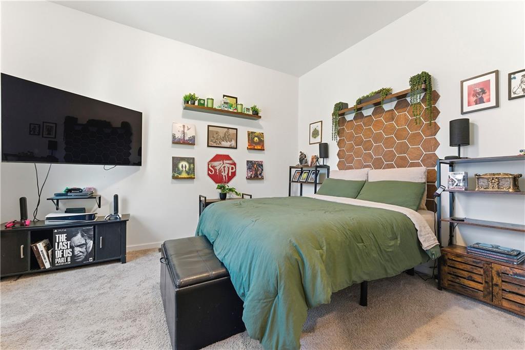 902 Gaston Street Southwest Atlanta, GA 30310 - Photo 21 of 36 a bedroom with a bed and a flat screen tv