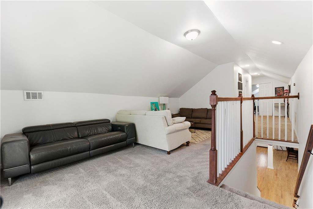 902 Gaston Street Southwest Atlanta, GA 30310 - Photo 26 of 36 a living room with furniture and a rug