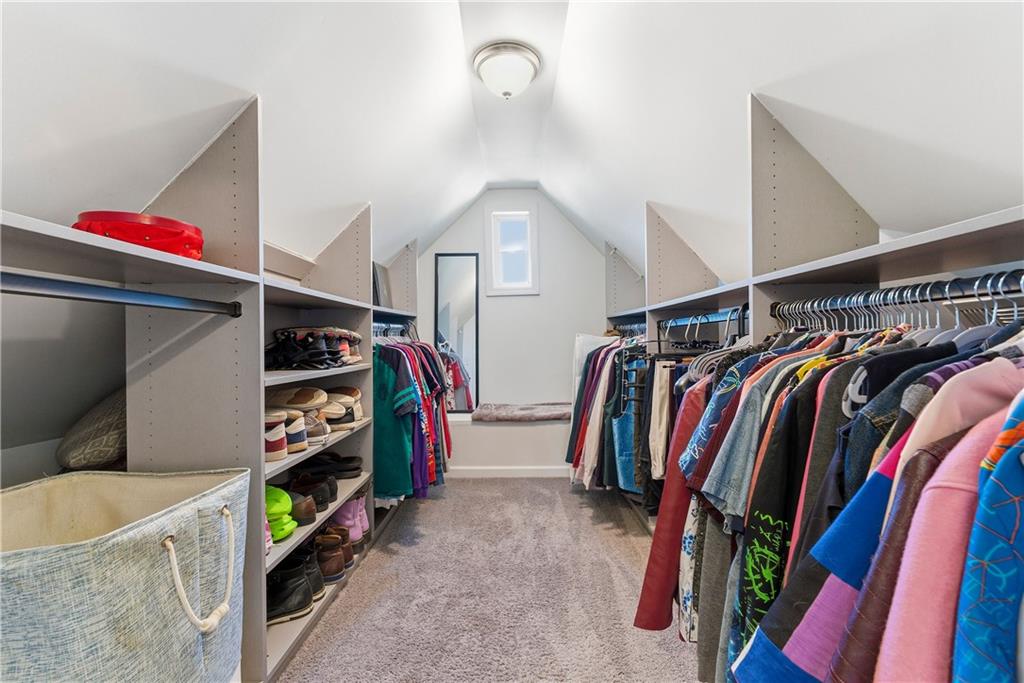 902 Gaston Street Southwest Atlanta, GA 30310 - Photo 28 of 36 a view of walk in closet with clothes and shoes
