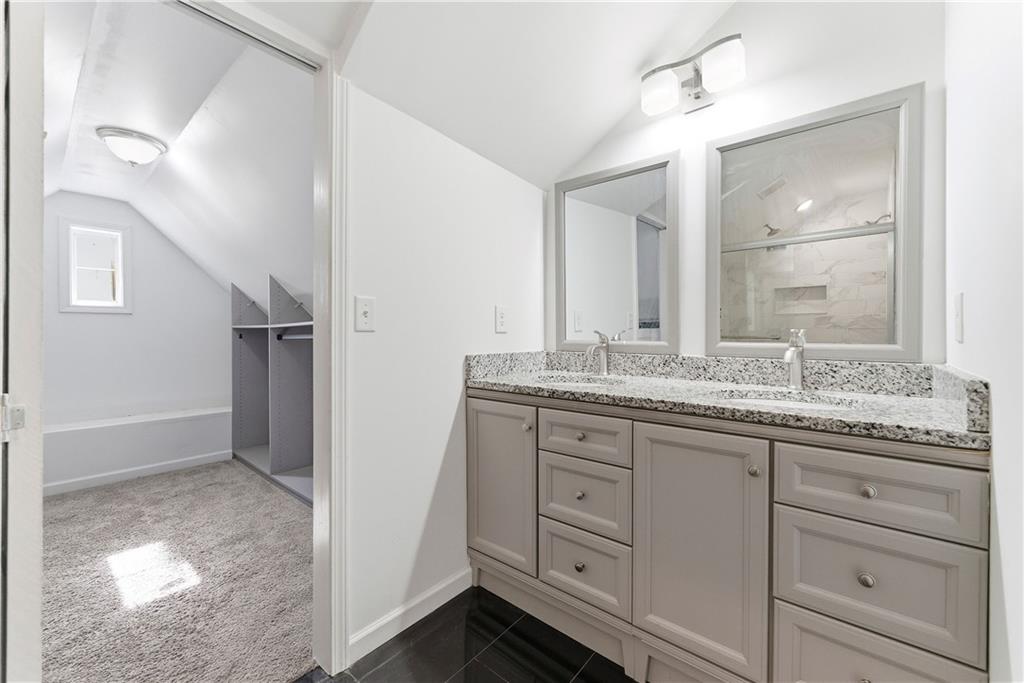 902 Gaston Street Southwest Atlanta, GA 30310 - Photo 29 of 36 a bathroom with a granite countertop sink mirror and double