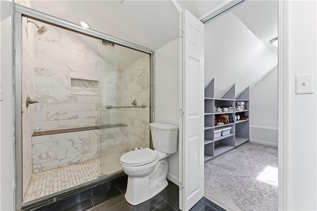 902 Gaston Street Southwest Atlanta, GA 30310 - Photo 30 of 36 a bathroom with a toilet and a shower