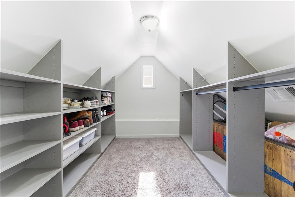 902 Gaston Street Southwest Atlanta, GA 30310 - Photo 31 of 36 a view of walk in closet with clothes and shoes