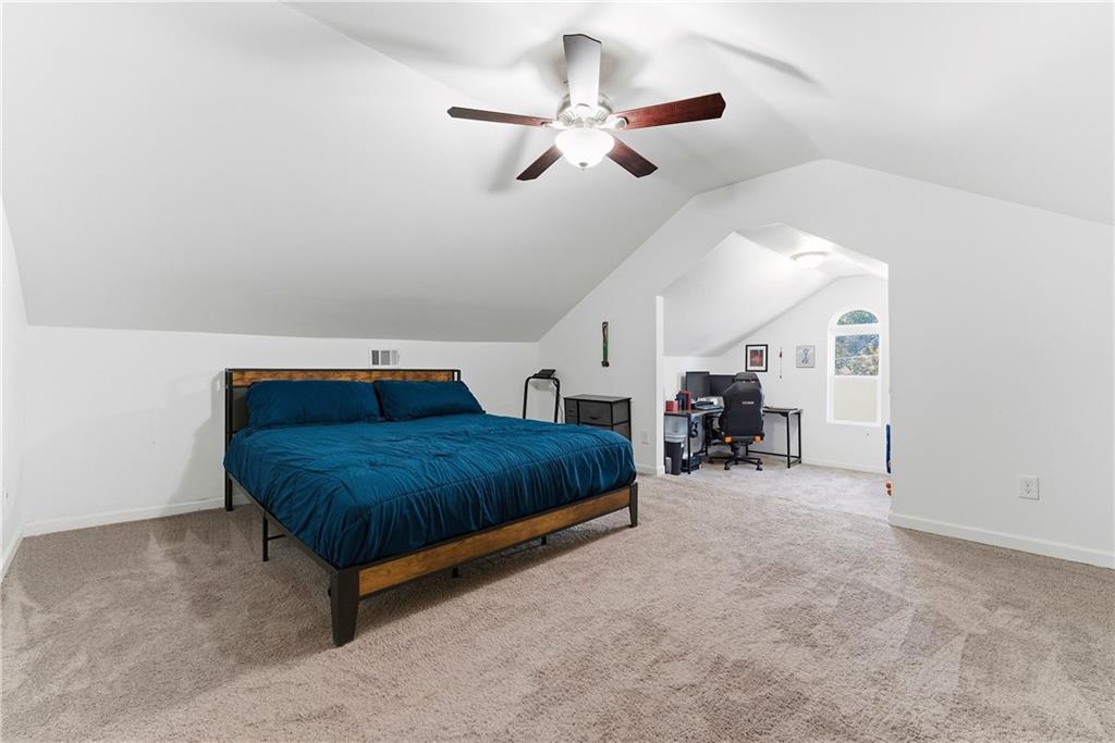 902 Gaston Street Southwest Atlanta, GA 30310 - Photo 32 of 36 a bedroom with furniture and a large mirror